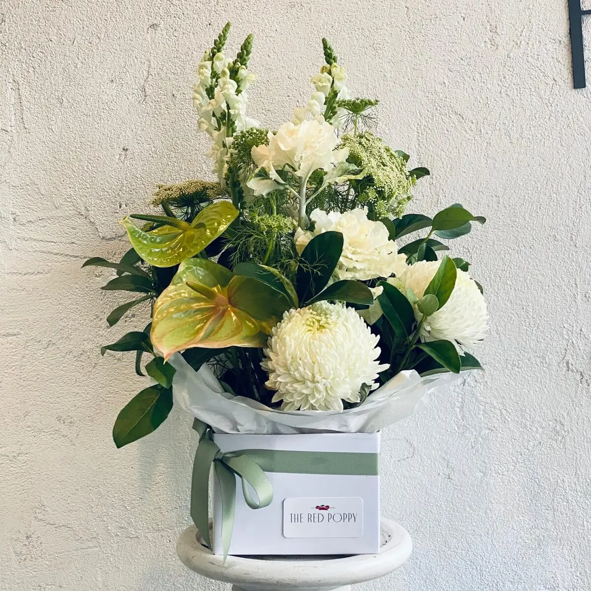 Boxed arrangement of white and green blooms in The Red Poppy gift box