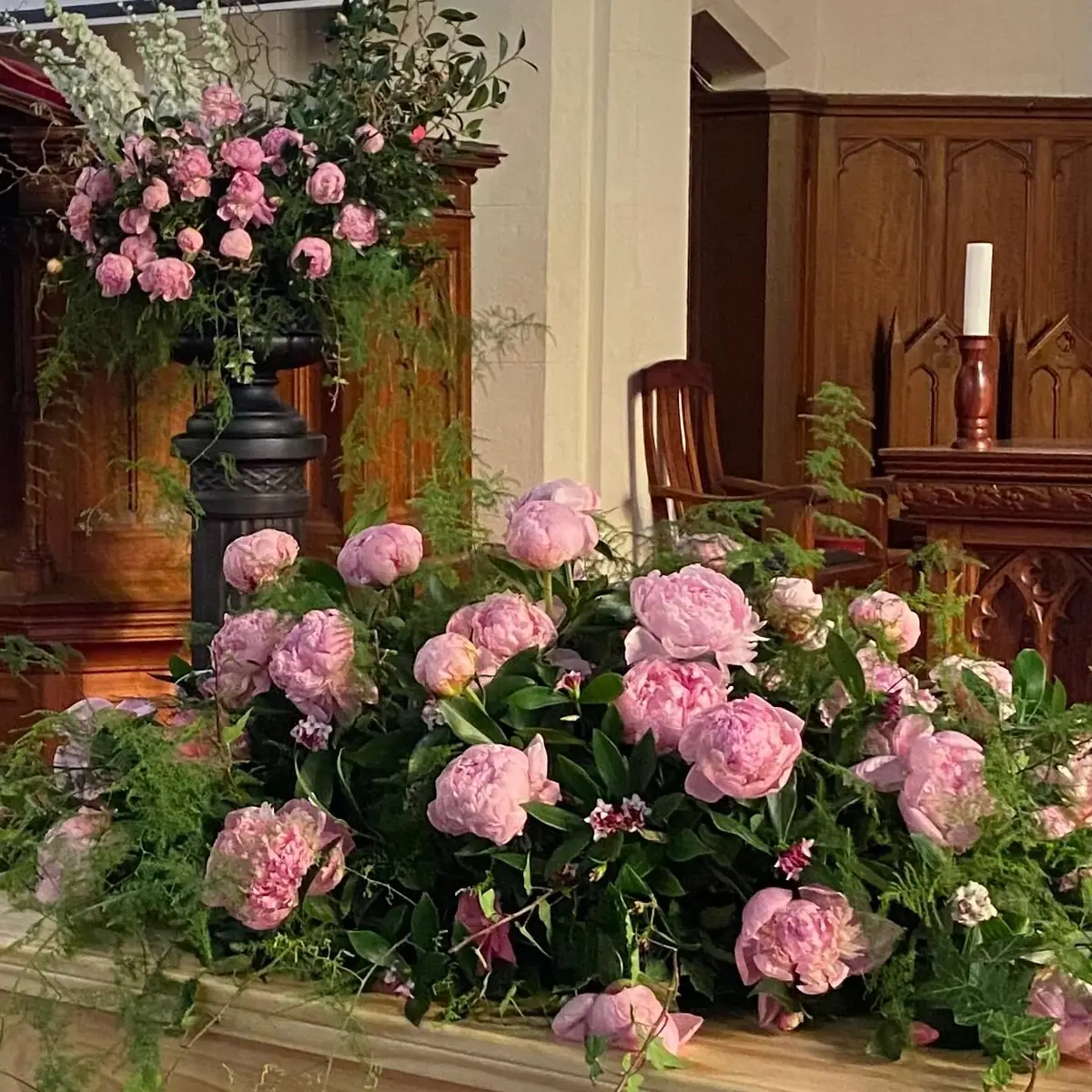 Pink peony urn arrangement and altar flowers in a Geelong church